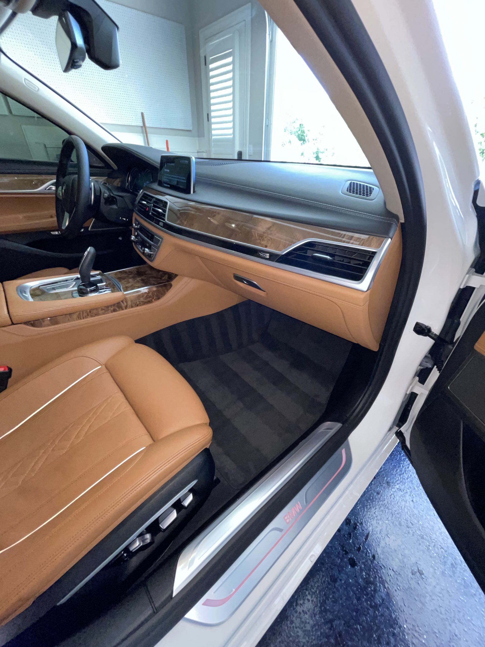 Photo Aug 09 2022, 10 09 23 AM Luxury car interior with tan leather seats, wood trim, digital display Cody X Pressure Washing