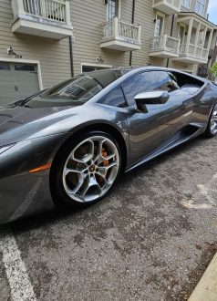 Photo Dec 18 2024, 9 16 02 AM (2) Gray Lamborghini parked on residential street by modern apartment building. Cody-X Pressure Washing