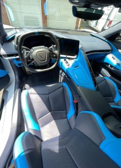 Photo Dec 18 2024, 9 16 02 AM (6) Chevrolet Corvette interior with black-blue seats, digital dash, logo wheel. Cody-X Pressure Washing