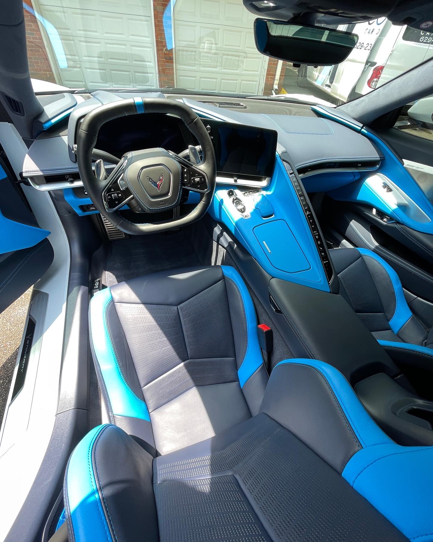 Photo Dec 18 2024, 9 16 02 AM (6) Chevrolet Corvette interior with black blue seats, digital dash, logo wheel Cody X Pressure Washing