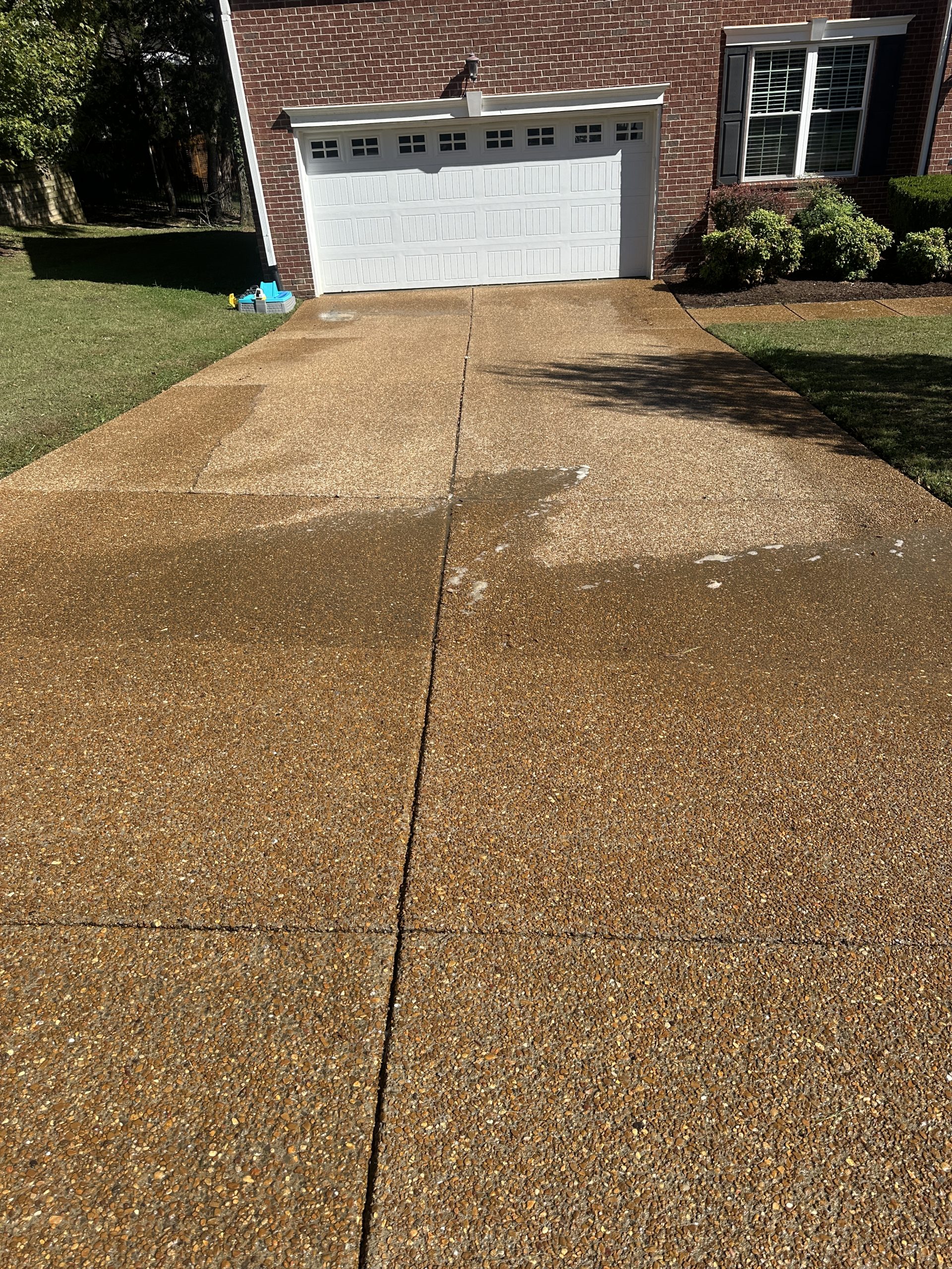 IMG_0861 Partially cleaned gravel driveway at brick house, showing contrast Cody X Pressure Washing