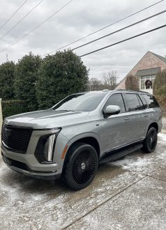 IMG_2033 A silver Cadillac Escalade on a snowy driveway at Cody-X's pressure washing business. Cody-X Pressure Washing