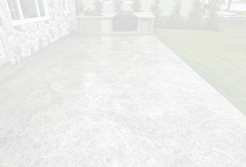 concrete-seal-bg Stamped concrete patio by stone house, built-in grill, green lawn; Cody-X service. Cody-X Pressure Washing
